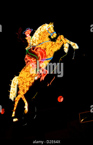 Cowboy on horse neon bulb light sign Fremont Street Experience Las Vegas downtown at night Stock Photo