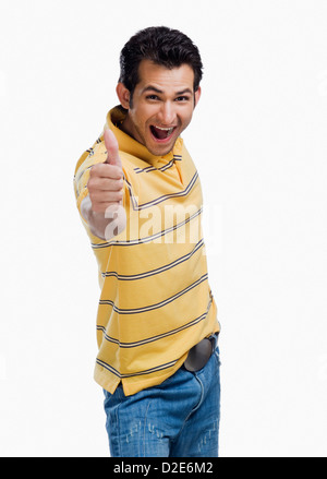 Portrait of a man showing thumbs up sign Stock Photo