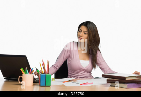 Female fashion designer working in an office Stock Photo