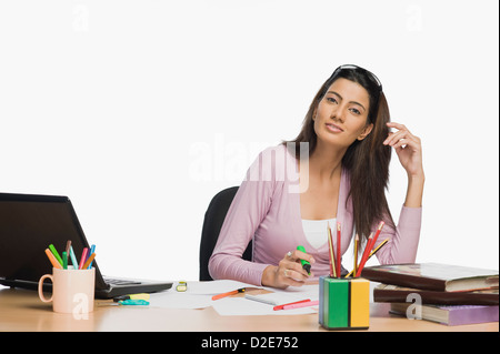 Female fashion designer working in an office Stock Photo