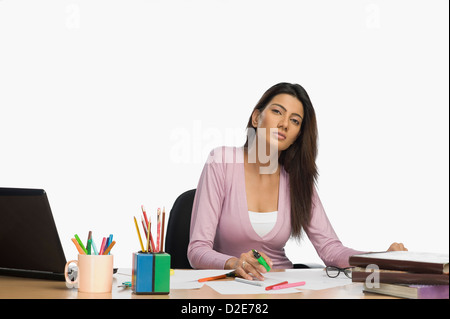 Female fashion designer working in an office Stock Photo