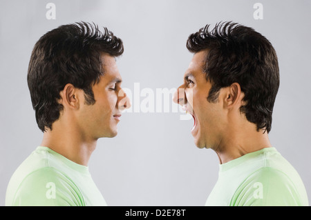 Digital composite image of a man yelling at self Stock Photo