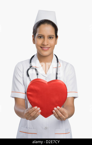 Close up of the nurse holding heart shape Stock Photo - Alamy