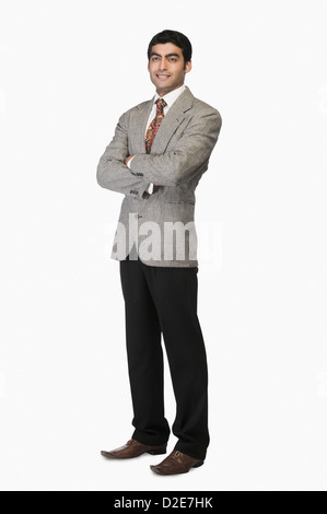 Portrait of a businessman standing with arms crossed Stock Photo