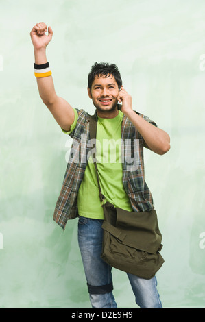 University student talking on a mobile phone Stock Photo