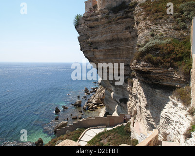 Mighty cliffs in a calm bay in Bonifacio on Corsica Stock Photo