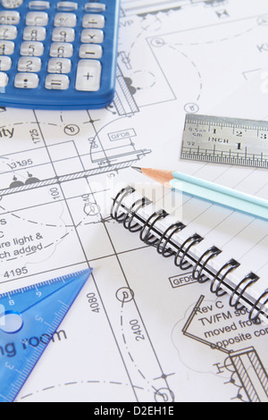 Drawing Equipment And Calculator On House Plans Stock Photo