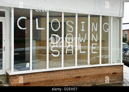Closing down sale notice in a shop window Stock Photo