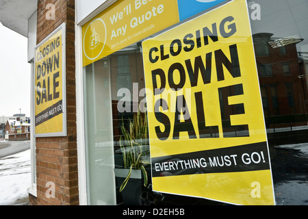 Closing down sale poster in a shop window Stock Photo