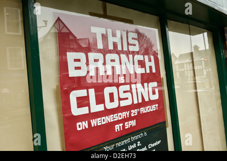 Closing down notice in a shop window Stock Photo