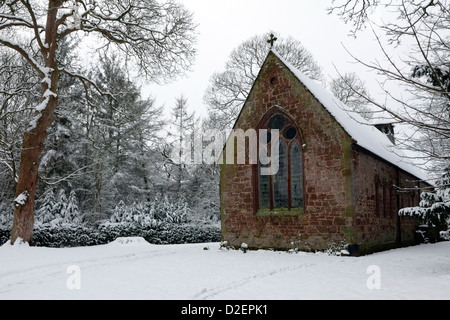 St Mary church in the village of Longnor in Shropshire,viewed here after heavy snowfall in January 2013. Stock Photo