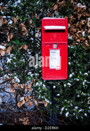 A traditional Red Post Box in Winter. Stock Photo