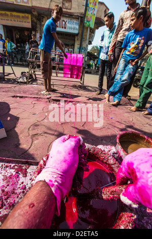 Coating kite string with ground glass for the Kite Festival or Uttarayan in Ahmedabad, Gujarat, India Stock Photo