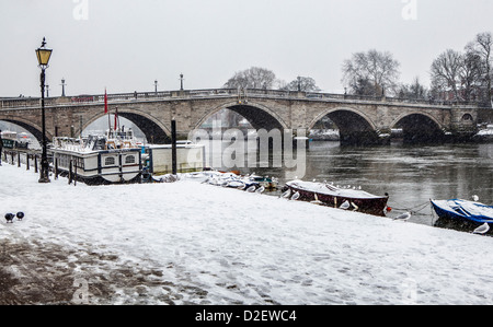 View of  Richmond bridge and the Thames river after a heavy snow fall in Winter - Richmond upon Thames, Greater London, Surrey, UK Stock Photo