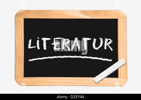 Detail photo of a Chalkboard with the German inscription literature, white chalk lies in a corner Stock Photo