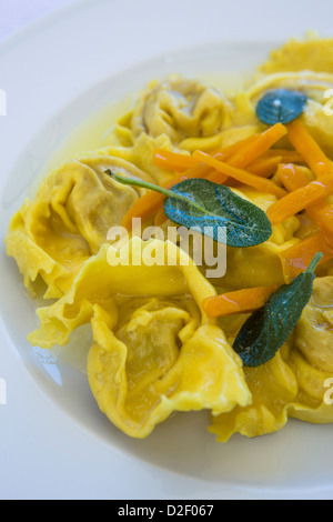 Large ravioli with pumpkin, butter and sage. Stock Photo