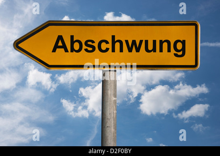 Detailansicht eines Wegweisers mit der Aufschrift Abschwung | Detail photo of a signpost with the German inscription downturn Stock Photo