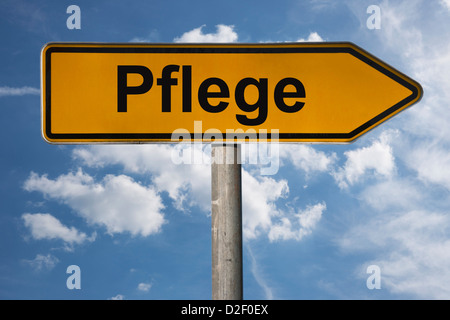 Detailansicht eines Wegweisers mit der Aufschrift Pflege | Detail photo of a signpost with the German inscription care Stock Photo