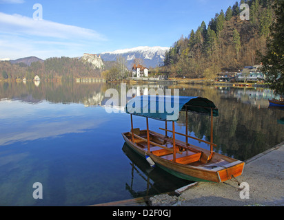 A Pletna, a covered wooden rowing boat on Lake Bled Slovenia Stock Photo