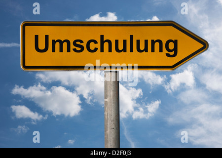 Wegweiser mit der Aufschrift Umschulung | Detail photo of a signpost with the German inscription retraining Stock Photo