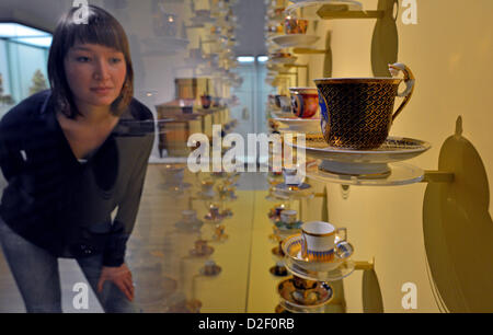 A woman looks at a 94 piece porcellain collection from German, French and Austrian manufacturers from the 18th and 19th centuries at the Grassi Museum for Applied Art in Leipzig, Germany, 22 January 2013. Last year, the museum had just 70,000 visitors, but there has been an increase of 25 percent this year. Photo: HENDRIK SCHMIDT Stock Photo