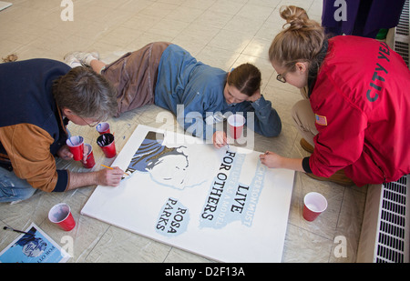 On Martin Luther King Jr. Day, volunteers painted posters to hang at Detroit Collegiate Prep High School. Stock Photo