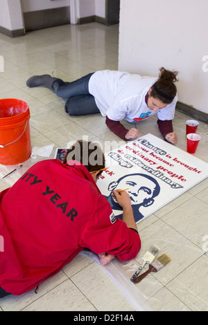 On Martin Luther King Jr. Day, volunteers painted posters to hang at Detroit Collegiate Prep High School. Stock Photo