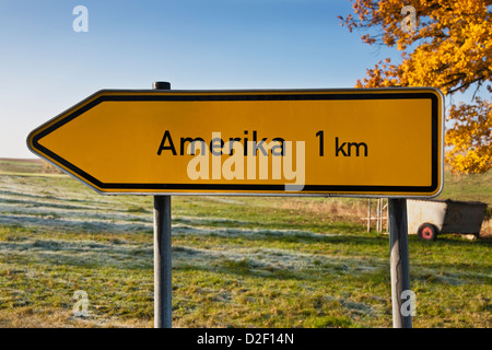 A signpost shows directory Amerika, 1 kilometer. America is the smallest locality of Penig, Saxony, Germany, Europe Stock Photo