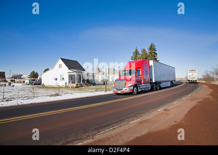 A semi truck drives through the ghost town of Shaniko, Oregon Stock Photo
