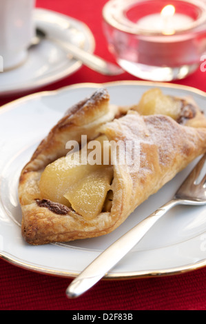 Puff pastry with pears, a chocolate hazelnut spread and walnuts. Stock Photo