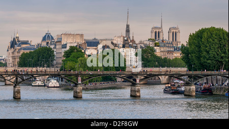 The banks of the Seine,The Pont des Arts and the Cathedral Notre Dame Stock Photo
