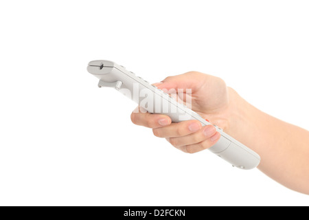 Beautiful woman hand with a tv remote control on a white isolated background Stock Photo