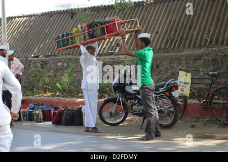 Dabbawalas pack food together for delivery at Andheri Station in Mumbai, India, 20 November 2012. 5,000 food delivers take 175,000 lunches to workplaces every day in Mumbai. Photo: Doreen Fiedler Stock Photo