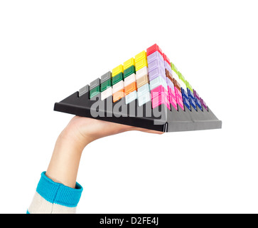 Woman hand holding a building block game disk Stock Photo