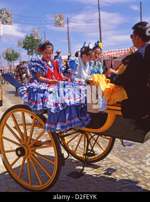 Girls in flamenco dress on carriage, Feria de abril de Sevilla (Seville April Fair), Seville, Sevilla Province, Andalucia, Spain Stock Photo