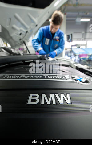 An employee is working on the engine of a BMW on Wednesday, 7 March 2012, at the BMW factory in Regensburg. Due to a sales record in 2011, the profit of the Bavarian automobile producer also rised in unknown hights. Stock Photo