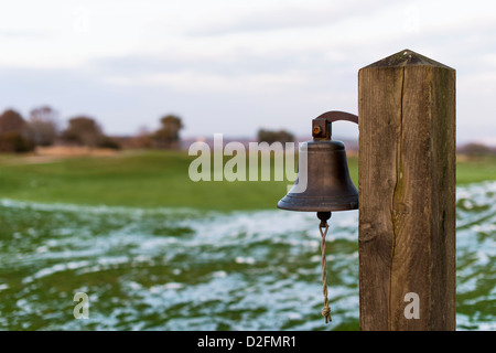 Teignmouth,Devon, England. January 21st 2013. A Bell at the 18th hole of Teignmouth golf course with the remains of heavy snow. Stock Photo