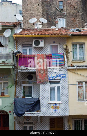 A house with rooftop satellite dishes in poor district of Tarlabasi, Istanbul. Stock Photo