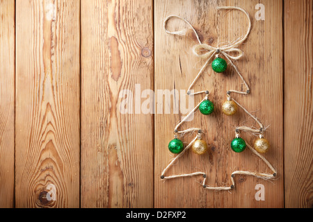 Christmas tree with balls on wooden background with copy space Stock Photo