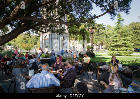 Istanbul: A beautiful tea garden beside Dolmabahce Palace where Turks and tourists drink tea and relax. Stock Photo