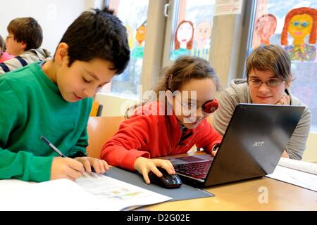 Students of the learn-family, the 'seals' join the class, in Bonn, Germany, 22 January 2012. Because of an exemplary, inclusive learning style, the school receives the Jakob-Muth-award. Photo: Marius Becker Stock Photo