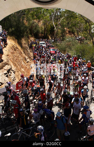 Huge crowd of amatuer cyclists make their way pass the KOM finish arch