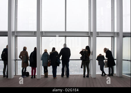 London, UK - 23 January 2013: visitors look at the panorama of London as seen from 'The View from the Shard'.  'The View from the Shard' opens to the general public on the 1st of February, offering an unrivalled view on the city of London.