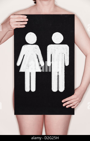 Woman holding a blackboard with male and female symbols - gender / reproduction / IVF / designer baby concept Stock Photo