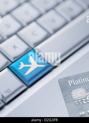 Detail of a laptop keyboard with one blue key with an plane symbol on Stock Photo: 50399717 - Alamy