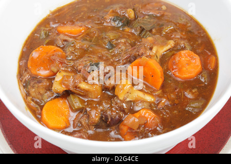 A serving bowl full of freshly home-made oxtail stew, a delicious traditional British or European food. Stock Photo