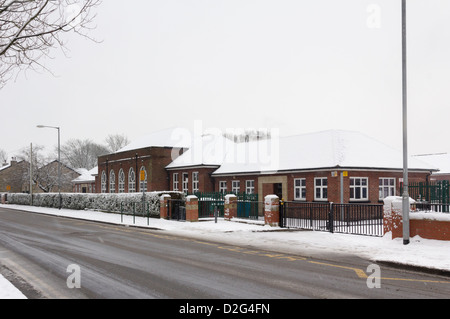 Highfield Primary School on Marsh Lane in Farnworth in winter. The school closed for the day due to the  weather conditions. Stock Photo