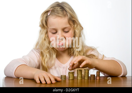 Berlin, Germany, little girl counts her allowance Stock Photo