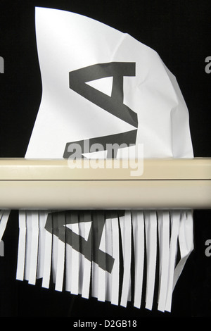 A printed AAA on A4 paper being shredded, symbolising a downgrading from the top rating of AAA. Stock Photo