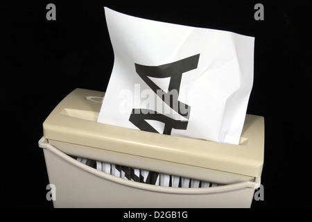 A printed AAA on A4 paper being shredded, symbolising a downgrading from the top rating of AAA. Stock Photo